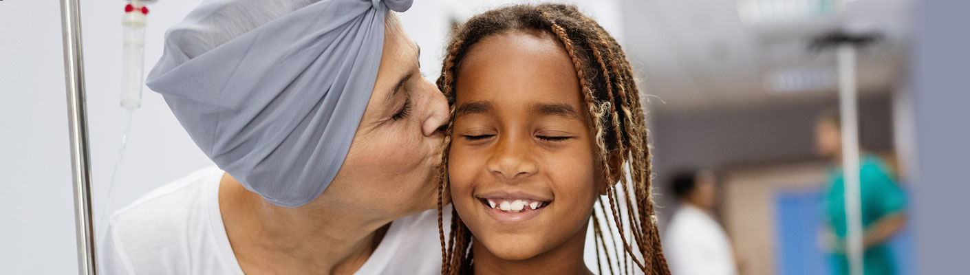 patient kissing a child's cheek