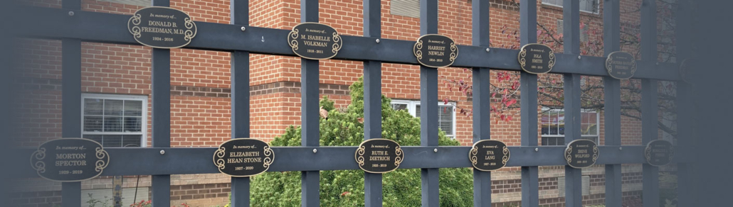 fence showcasing homeland tribute medallions
