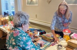 resident browsing items at the Homeland Holiday Bazaar