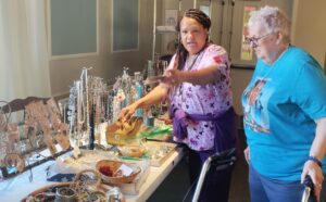 Homeland Holiday Bazaar staff and resident shopper