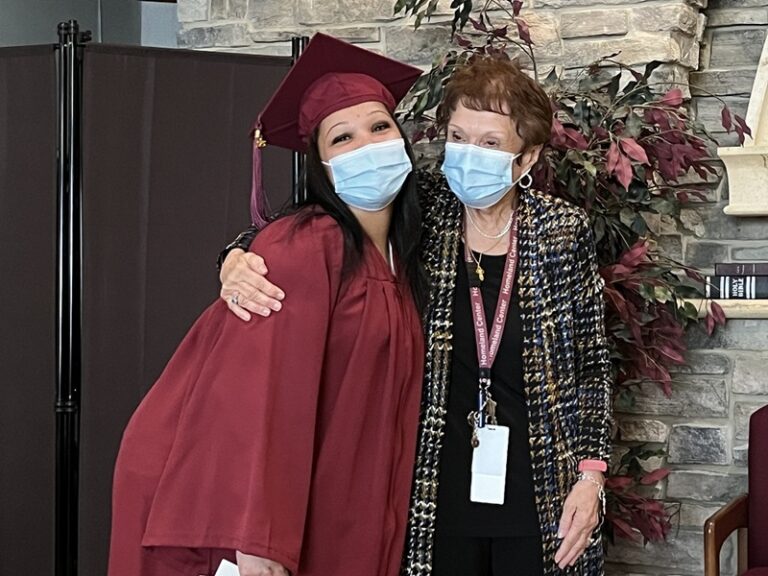 graduate posing for cna training graduation ceremony