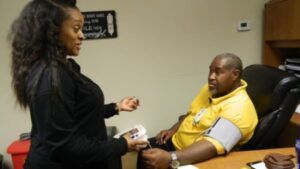 wellness coordinator roxane hearn with an employee