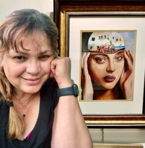 artist evelyn dunbar posing with a painting