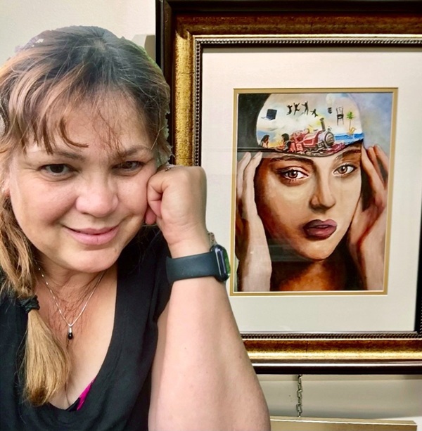 artist evelyn dunbar posing with a painting