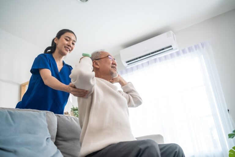 a nurse helping a patient with physical exercise