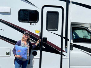 sharon clark posing with her RV