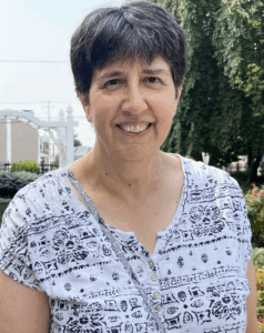 board of managers member sue zaccano smiling outside of Homeland Center