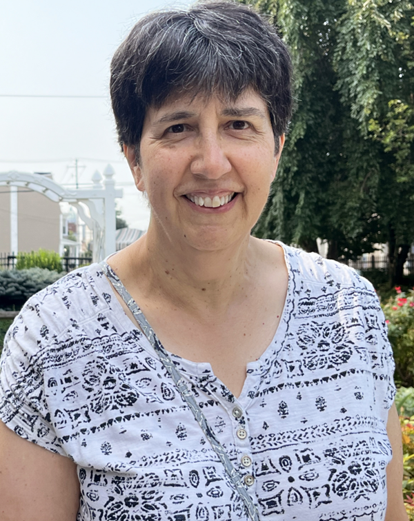 board of managers member sue zaccano smiling outside of Homeland Center