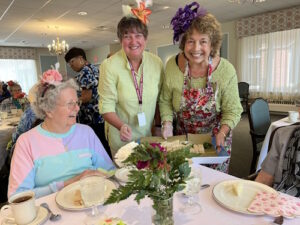 residents and staff enjoying the homeland tea party