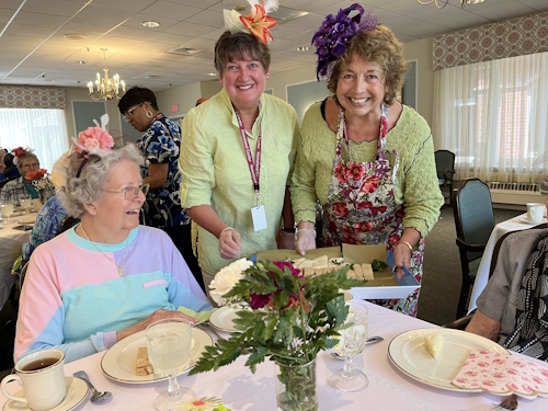 residents and staff enjoying the homeland tea party