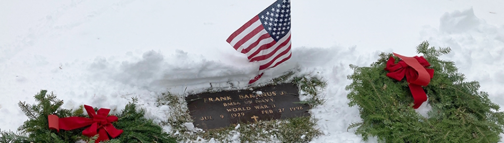 banner featuring a close up photo of a veteran's grave with wreaths