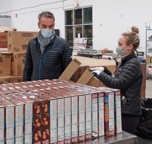 homeland staff volunteering at the food bank