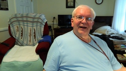 resident Jim Phillips relaxing inside a homeland center room